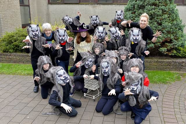 Lynn McCarron and Irena Noonan, from the Greater Shantallow Community Arts project, pictured with the witch and wolves pupils from Steelstown Primary School who with take part in Derrys forthcoming Halloween Festival parade.   DER4318GS011