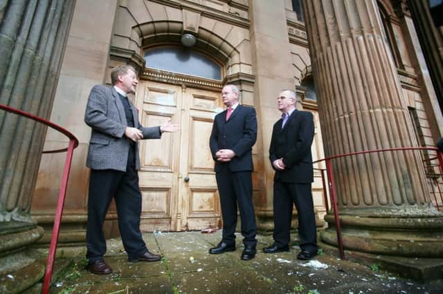 2007... Rev. David Latimer talking to Martin McGuinness and Raymond McCartney during their visit to view damage caused by vandals to the exterior of First Derry Presbyterian Church.
