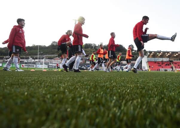 Derry City players warm up prior to their FAI Cup quarter-final tie Bohemians at the Brandywell.