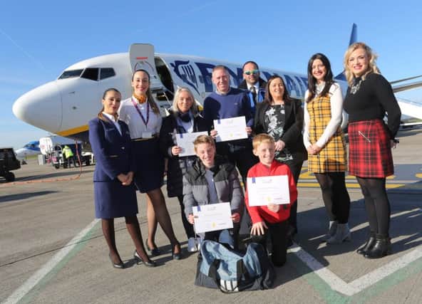 Passengers and crew on the inaugural Ryanair flight from Derry to Edinburgh.