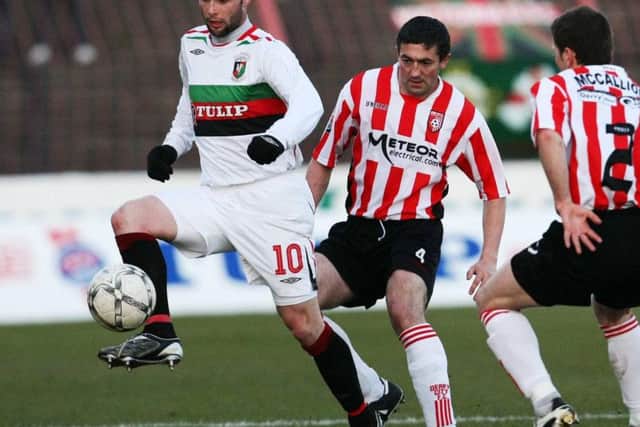 Gary Hamilton pictured playing for Glentoran at the Oval against Derry City's Peter Hutton and Eddie McCallion in the Setanta Cup in 2008.