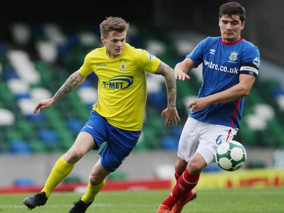 Dungannon Swifts' Paul McElroy (left) fired home a second half brace to defeat Institute.