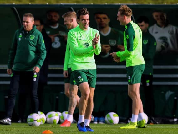 Republic of Ireland captain, Seamus Coleman has a laugh with former Derry City striker, Ronan Curtis at training.