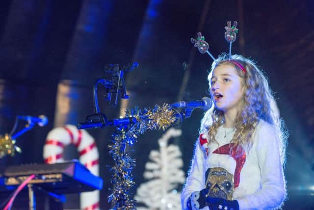 Cora Harkin performs on stage at the Christmas Lights Switch on in Derry last year.