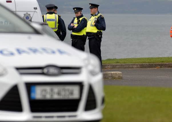 Members of An Garda SÃ­ochÃ¡na and Irish Coast Guard personnel at Buncrana Shorefront, yesterday, close to where the Red Ford Fiesta belonging to missing Derry woman  72 year-old Jean McGahey was found. DER4718GS001
