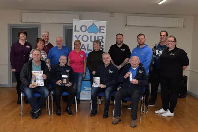 Group pictured at the recent relaunch of the Pink Panthers Cancer Community Services, at Ballymagrotary Community Centre, to coincide with Movember male cancer awareness month. Included in the photograph are Maureen Collins, manager, Pink Ladies, Margaret Cunningham, facilitator, Pink Ladies, James Nash, chairman, Pink Panthers and Jacquie Loughrey, Co-chairperson, Pink Ladies. DER4818GS003