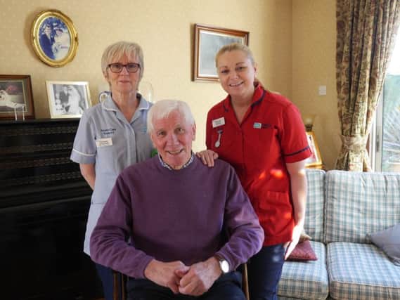 Patient Hugh Lyndsay from the Waterside pictured with the Western Trust Acute Care at Home Team staff Concepta ODonnell, Acute Care at Home Support Worker and Deborah McDaid, Acute Care at Home Sister.