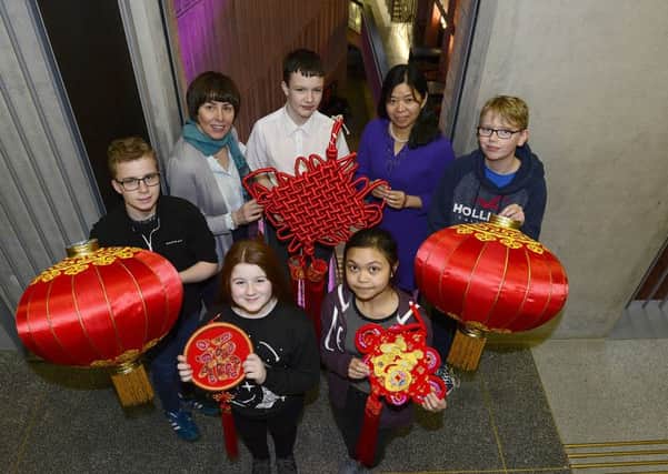 Pupils from Lumen Christi College: In the back row: Owen McFadden, Matthew Duffy, Oisin Toner, front row: Niamh Fleming and Erin Lazarte  are joined by their Mandarin teacher Changqing Guan and teacher Marie Ferris at the MAC in Belfast