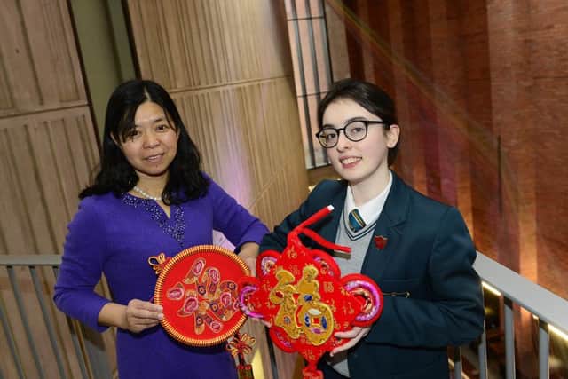 Eve Flood from Thornhill College in Derrryy is joined by her Mandarin teacher Changqing Guan at the MAC