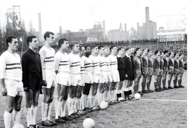 Jobby Crossan, eighth from the left, pictured with the Standard Liege team prior to the European Cup semi-final first leg against Real Madrid in Belgium. The Madrid side includes the great Alfredo Di Stefano (third from right) and Ferenc Pusks (extreme right).