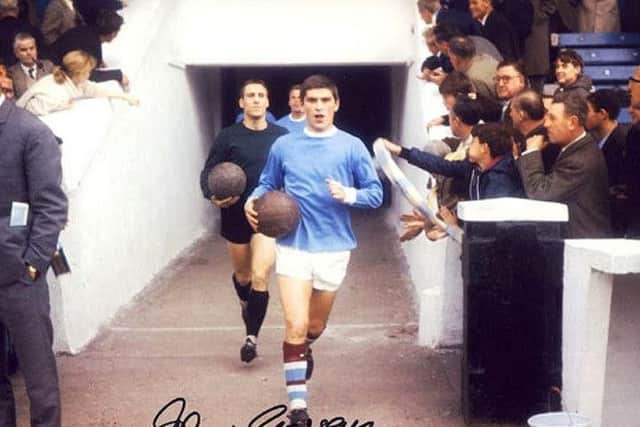 Jobby Crossan leads out the Manchester City side as captain during the 1965/66 promotion winning season