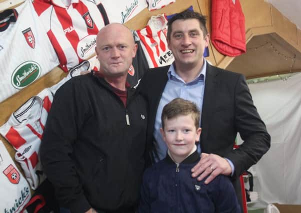 Derry City supporter Finn Doherty with his uncle Stephen met boss Declan Devine and new signing Greg Sloggett when visiting club's pop-up shop on Shipquay Street, on Saturday.