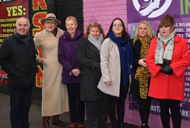 Sinn Fein representatives and activists at the mural unveiling.