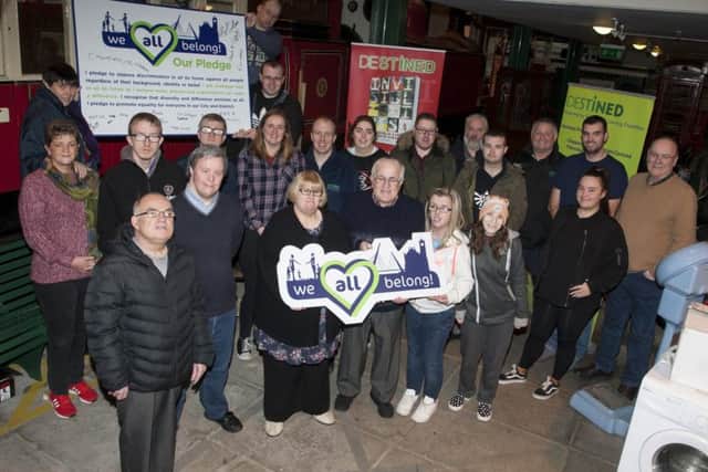 The group from Destined sign the pledge to tackle prejudice and hate crime â¬ÜWe All Belongâ¬" at their Foyle Road, Derry premises this week.