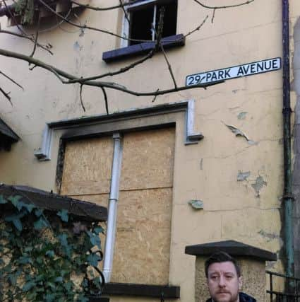 Independent Councillor Darren O'Reilly pictured outside the house in Rosemount.