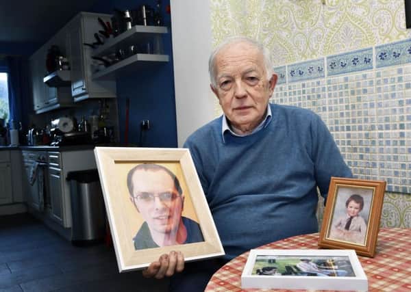 Jim McCauley with a picture of his murdered son, Paul.