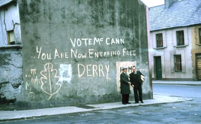 The original slogan daubed on the Bogside gable wall.