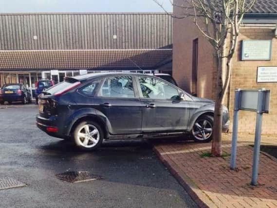 Someone needs to Focus on their car parking skills.