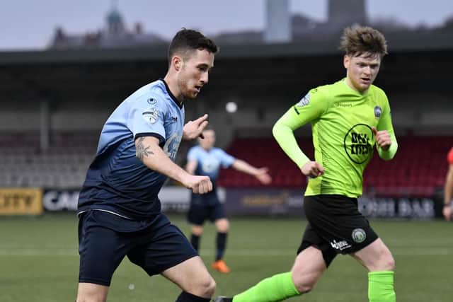 Institute's Jamie McIntyre runs at the Warrenpoint Town defence during Saturday's Irish Cup tie at the Brandywell. DER0219-105KM