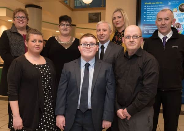 Keelan O'Hagan, centre, who received a Recognising Achievement Award from the Council for the Curriculum Examinations and Assessment (CCEA), pictured with his Dad Peter O'Hagan and Karen Carlin. Also pictured (back, from left) are: Sharon Thompson, Ardnashee College, Karen Moore, Dept Head of Training and Skills, North West Regional College, Uel Murphy, NWRC Lecturer, Sharon Cassidy, Ardnashee College, and John Cartin, Deputy Dept Head of Training and Skills, North West Regional College. (Picture Martin McKeown).
