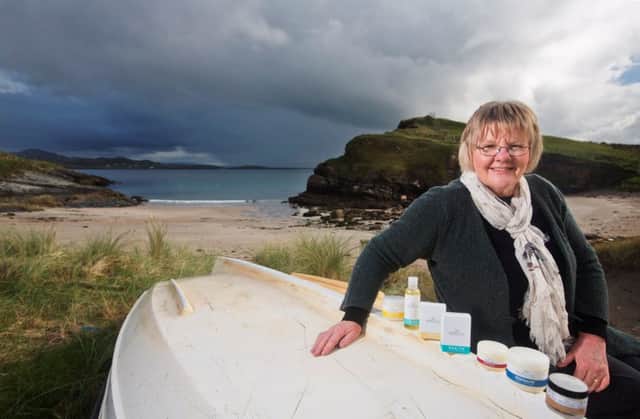 Dr Maria McGee pictured with some of her all-natural skincare products at Marble Hill Strand in Donegal.