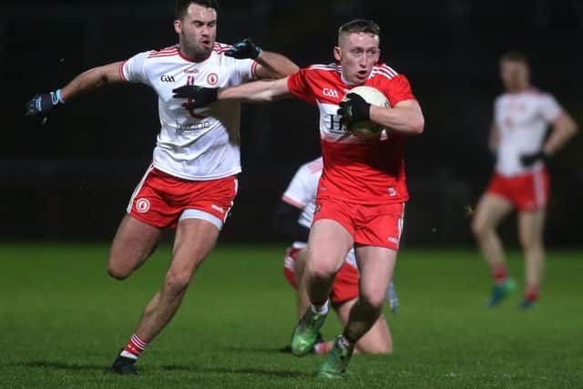 Derry's Sean Quinn takes on Kyle Coney during the McKenna Cup Group game before Christmas.
