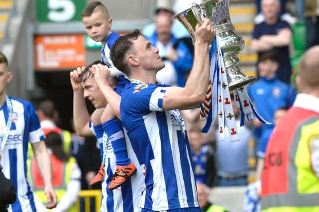 Coleraine's Darren McCauley celebrates with the Irish Cup.