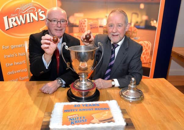 Stephen Elliott and Brian Irwin make the draw for the Nutty Krust Floodlit Cup 2019