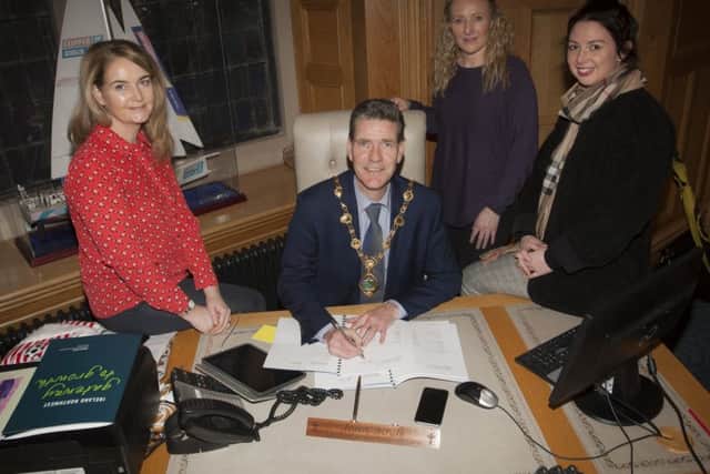 The Mayor of Derry City and Strabane District Council, John Boyle pictured signing the Planning Obligation under Section 76 of the Planning (Northern Ireland) Act 2011 documentation for Lands at Thornhill College, Culmore Road, Derry at the Guildhall on Friday last. Included from left are Andree McNee, Principal Planning Officer, Sarah Barrett, Senior Planning Officer and Fiona Long, Project Manager.