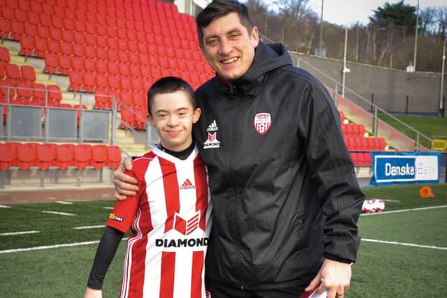 Adam Morrison pictured with Derry City manager Declan Devine before Sunday's training session.