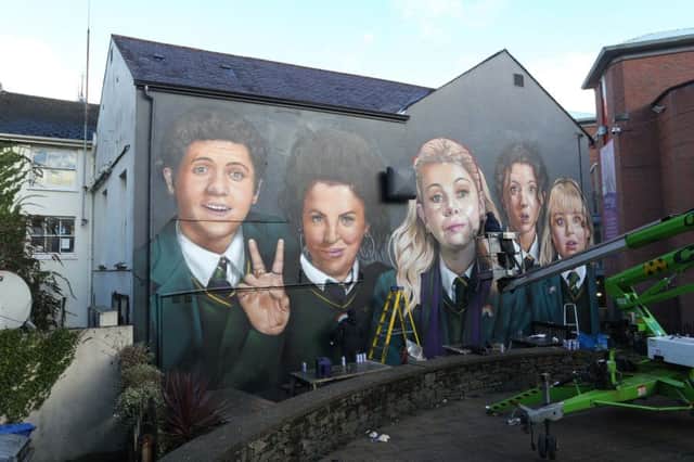 Derry graffiti artists UV Arts painting a mural of the lead characters of the Channel 4 comedy 'Derry Girls' on the wall of Badger's Bar, Orchard Street, Derry, to celebrate the return of the hit comedy.
 (Photo by Lorcan Doherty / Press Eye)