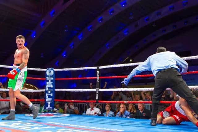 Coyle floors Danny Pastrana to clinch the NBA Intercontinental middleweight title in Florida.