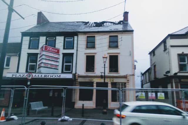 The aftermath of Sunday's fire can be clearly seen at John Barr's Drapers and the Plaza Ballroom.