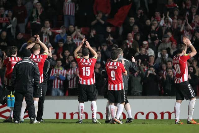 Derry City players applaud the travelling support at Windsor Park.