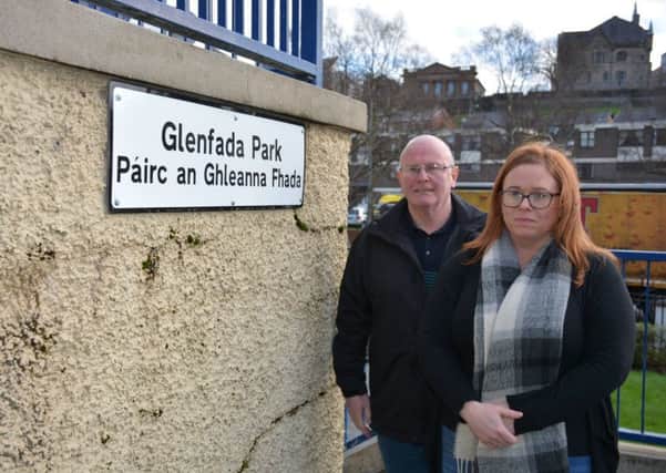 Councillors Kevin Campbell and Sharon Duddy at signs erected at Glenfada Park in the Bogside