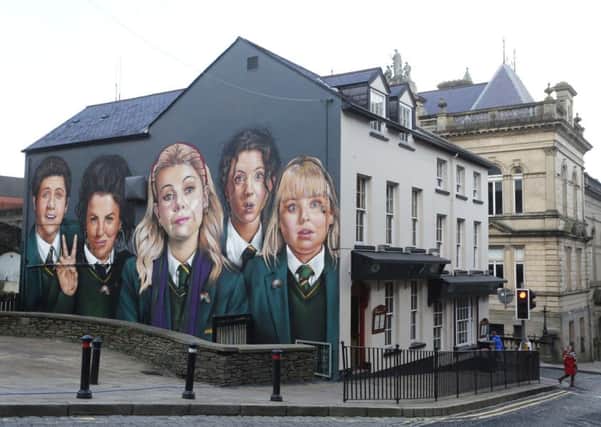 Press Eye - Belfast - Northern Ireland - 27th January 2019.
Photo by Lorcan Doherty / Press Eye.
Derry graffiti artists UV Arts painting a mural of the lead characters of the Channel 4 comedy 'Derry Girls' on the wall of Badger's Bar, Orchard Street, Derry, to celebrate the return of the hit comedy.