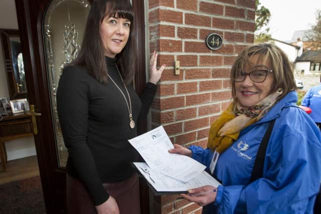 FUEL USE SURVEY. . . . . .Minty Thompson, Data Collector/Survey Interviewer, Social Capital North West pictured calling on householder Amanda McParland at her Greenhaw home this week as part of the launch of the Fuel Use Survey initiated by Derry City and Strabane District Council. Survey Interviewers will be knocking on doors across the Council Area in the coming weeks asking householders to take part in the survey.