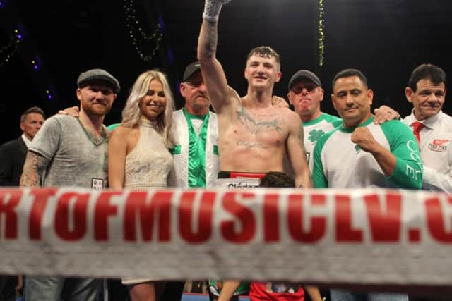 Connor 'The Kid' Coyle raises his hand in victory after an impressive unanimous points win over Travis Scott at the Coliseum in Florida.