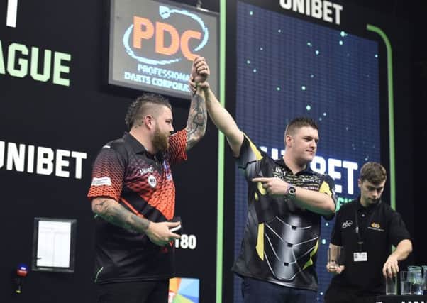 Daryl Gurney (right) defeated Michael Smith in the Unibet Premier League at the 3Arena, Dublin.