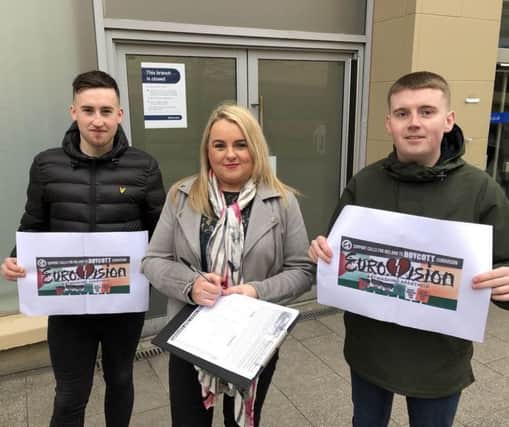 Councillor Sandra Duffy with Caolán McGinley and Naill Rodgers collecting signatures in the city