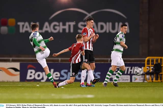 Dylan Watts fires Rovers in front in the first half despite the best efforts of Ciaron Harkin to close him down.