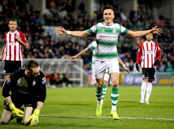 Shamrock Rovers' Aaron McEneff celebrates scoring a penalty and their second goal against Derry City.