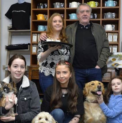 Lisa McClure, from the dog friendly the Warehouse Café and Radio Ulsters Sean Coyle pictured with prize winners from the recent Face of Warehouse Café Facebook competition. Anna Devines   Chihuahu Lola, on the left, was a runner-up, Nicole Gambles Cockapoo April  took first prize and Saoirse Martins Golden Retriever Daisy was a runner-up. DER0819GS-030