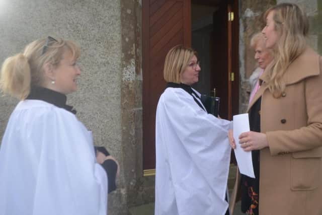 Parish reader Valerie McKinley and Rev Suzanne Cousins greet parishioners Mary and Tracey Kerrigan after Sunday morning's Service of Morning Prayer in St Finian's Church, Greencastle