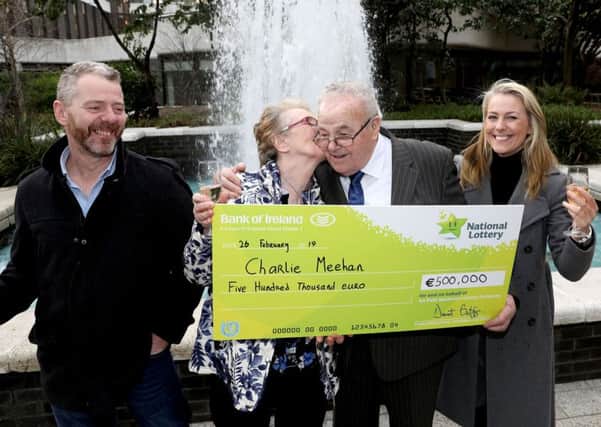 Charlie Meehan, 84, from Manorcunningham, one of those winners is pictured with his wife Ruby and Son Niall and daughter Ann when he collected his winnings from the National Lottery HQ. Pic: Mac Innes Photography