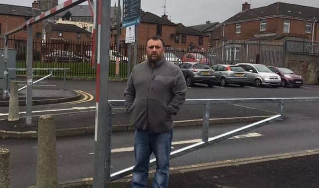 Independent Councillor Gary Donnelly pictured previously at the new gates when they were installed back in January.