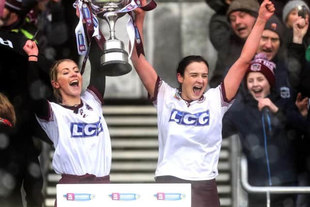 Slaughtneil 's joint captains Grainne OKane and Siobhan Bradley lift  trophy after Sunday's AIB All-Ireland Senior Camogie Club Championship Final in Croke Park.