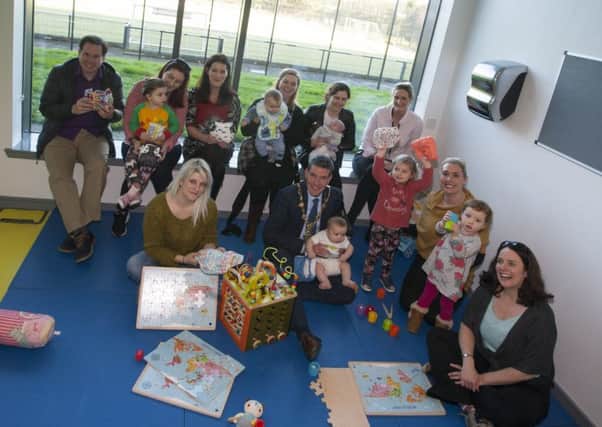 NAPPUCCINO TIME!. . . . The Mayor of Derry City and Strabane District Council, John Boyle pictured with parents, children, organisers and stallholders at DCSDCs  previous Nappuccino event at the Foyle Arena. The event was held to showcase the benefits of reuseable nappies and baby wipes.