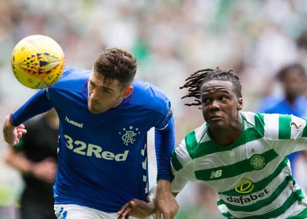 Celtic's Dedryck Boyata (right) and Rangers Kyle Lafferty