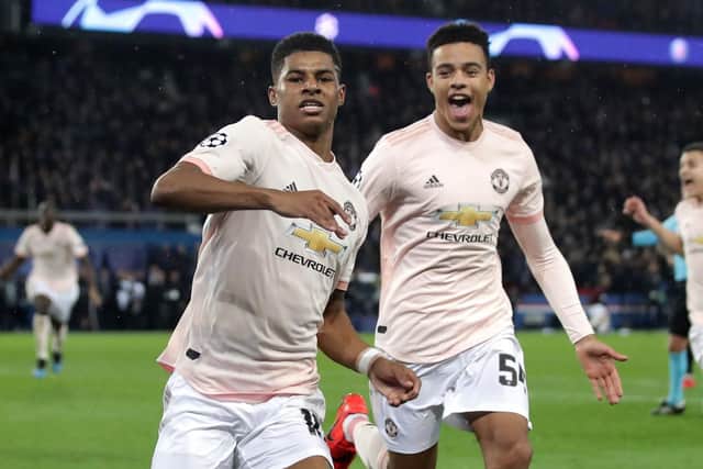 Manchester United's Marcus Rashford celebrates after scoring against Paris Saint-Germain, at the Parc des Princes.